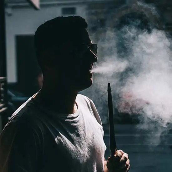 Silhouette of a man vaping