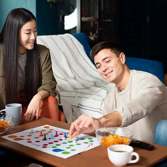 Friendship Day Special ideas from 7Engines - a couple playing board games.