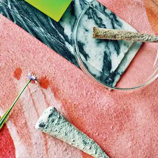 A joint among other items in a painting.