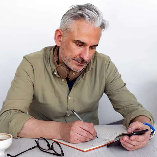 Man writing a journal