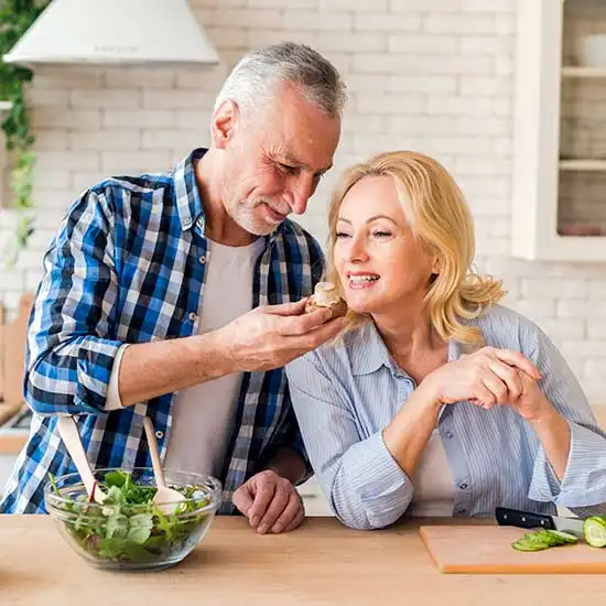 Middle aged couple having healthy food