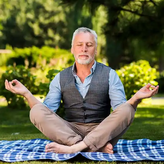 Middle aged man doing meditation