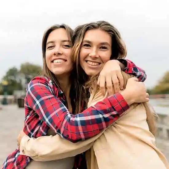 Two friends hugging each other on friendship day