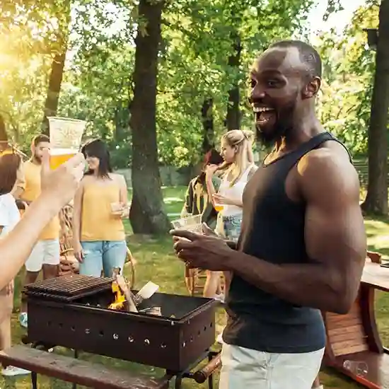 People relaxing over a barbecue