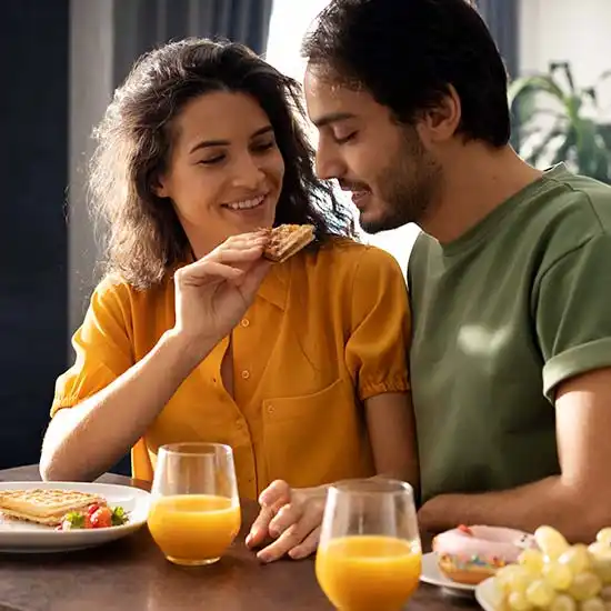 Young couple enjoying a healthy breakfast meal