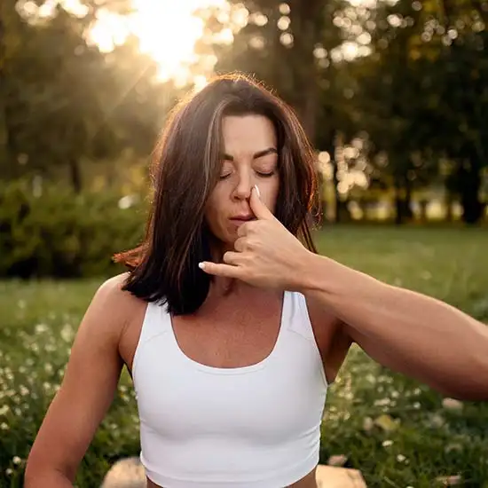 Woman doing breathing exercises for COPD