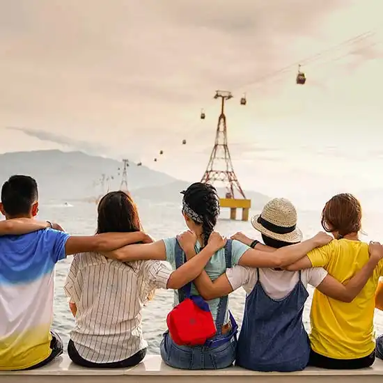 Group of friends with arms on each other's shoulders