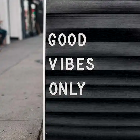 The words GOOD VIBES ONLY displayed on a board on World Kindness Day