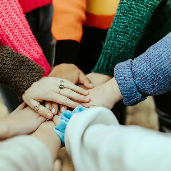 Hands joined in unity on World Kindness Day