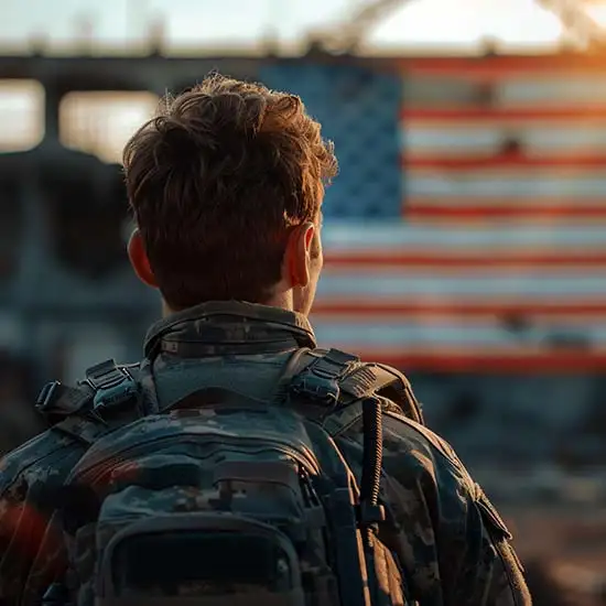 Soldier looking at US flag